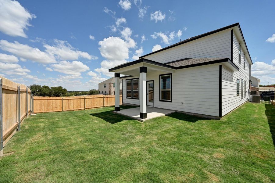 Front exterior of a new home in Creekside at Estancia, Austin, TX, highlighting curb appeal (Image 19).