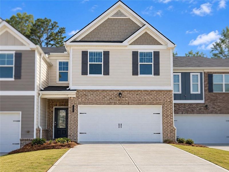 Front exterior of a new home in Lake Harbin, Morrow, GA, highlighting curb appeal (Image 2). Front exterior of a new home in Lake Harbin, Morrow, GA, highlighting curb appeal (Image 2).