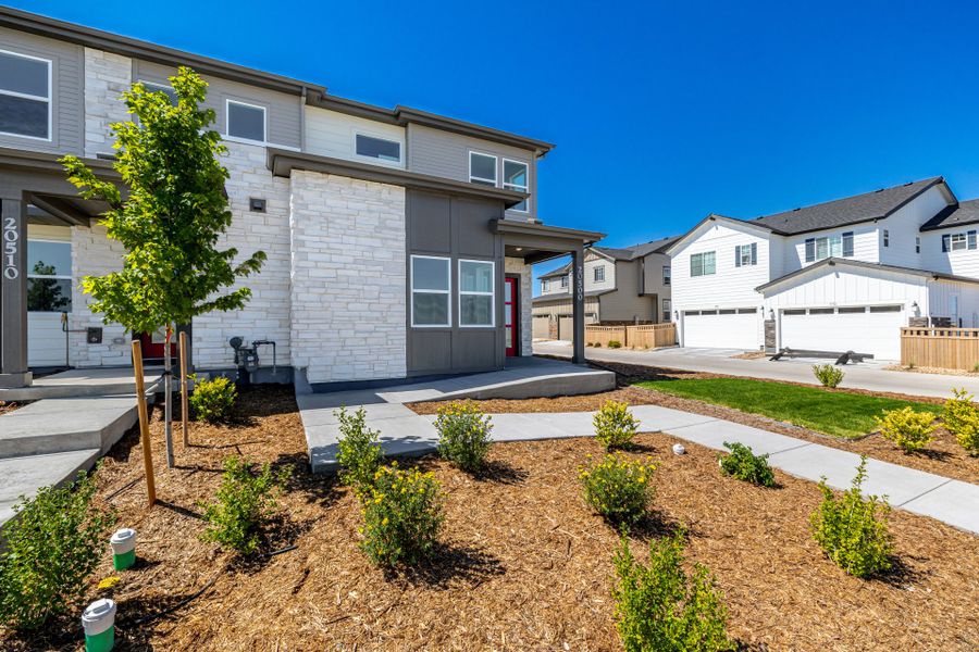 Front exterior of a new home in Painted Prairie, Aurora, CO, highlighting curb appeal (Image 23). Front exterior of a new home in Painted Prairie, Aurora, CO, highlighting curb appeal (Image 23).