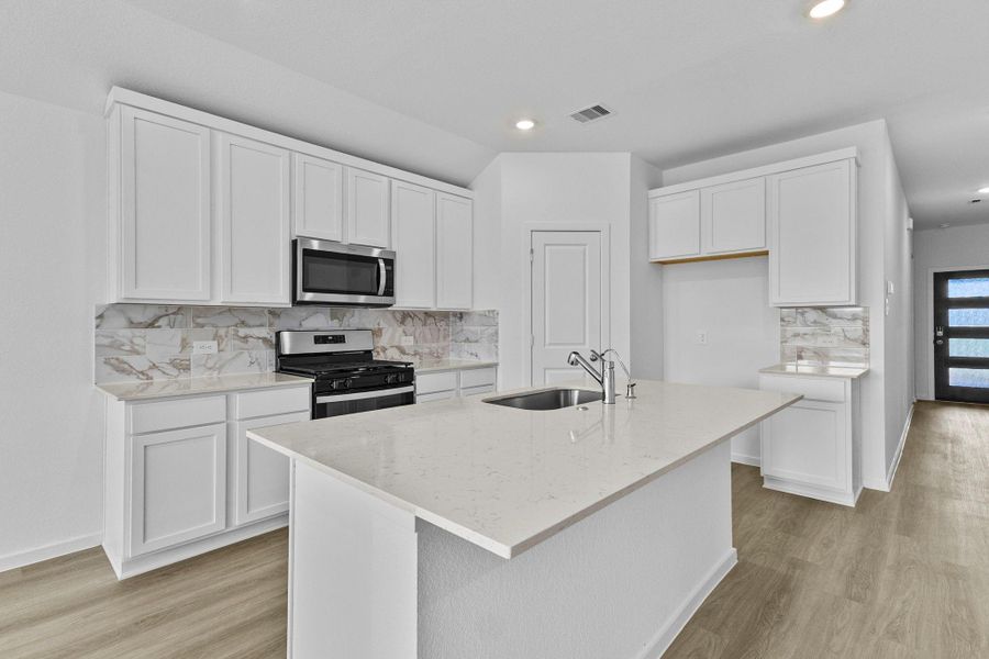 Furnished interior view inside a new home in Sunterra Lakes, Katy (Image 11).