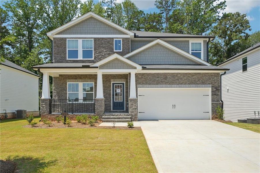 Front exterior of a new home in Martin Springs - Estate Series, Lawrenceville, GA, highlighting curb appeal (Image 23). Front exterior of a new home in Martin Springs - Estate Series, Lawrenceville, GA, highlighting curb appeal (Image 23).