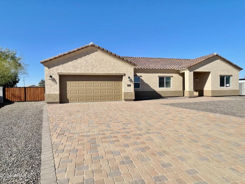 Front of home with RV gate and parking