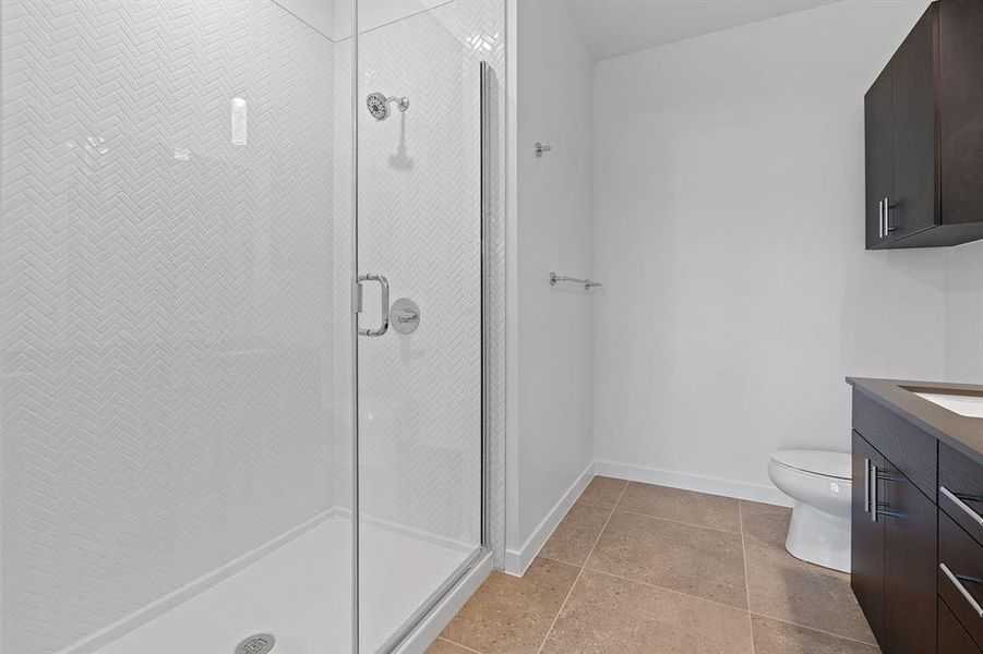 Primary walk-in shower.