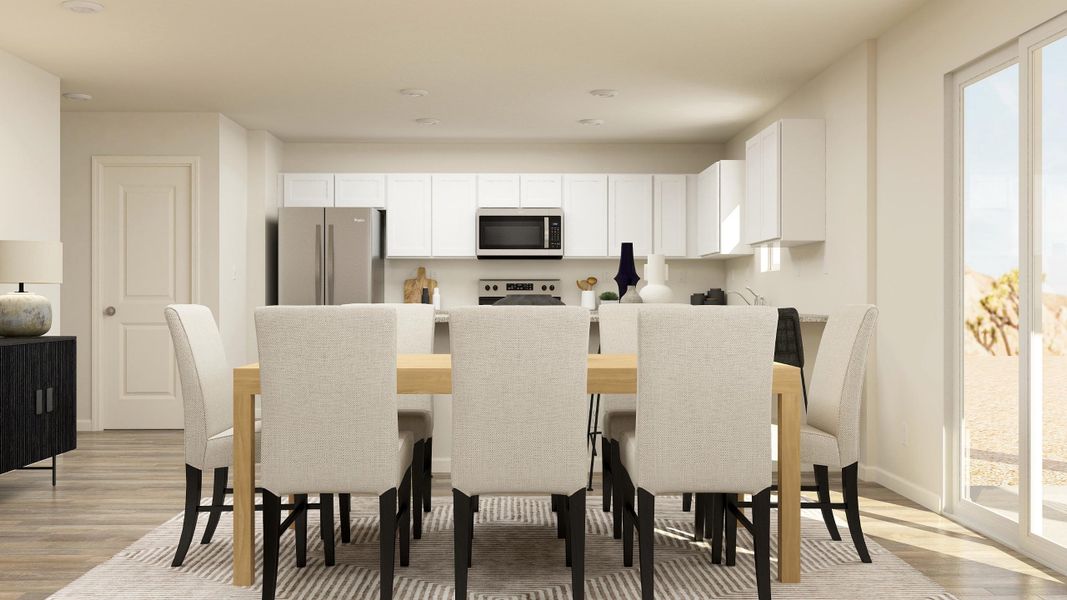 A kitchen with a dining table. A kitchen with a dining table.