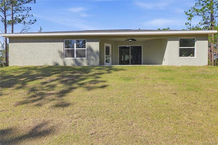 Exterior details and patio area of a home in , Citrus Springs (Image 29).