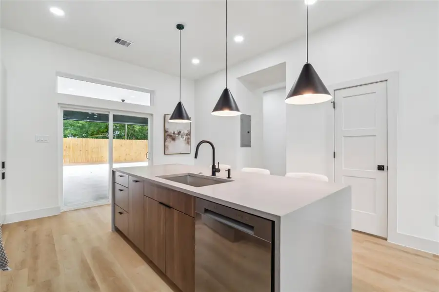 Earth-toned cabinetry pairs seamlessly with sleek countertops and modern lighting to create a balanced, high-design aesthetic that feels both grounded and refined. Earth-toned cabinetry pairs seamlessly with sleek countertops and modern lighting to create a balanced, high-design aesthetic that feels both grounded and refined.