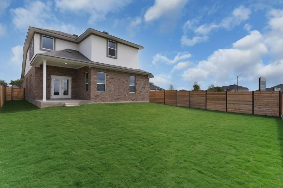 Exterior details and patio area of a home in Highland Village, Georgetown (Image 13).
