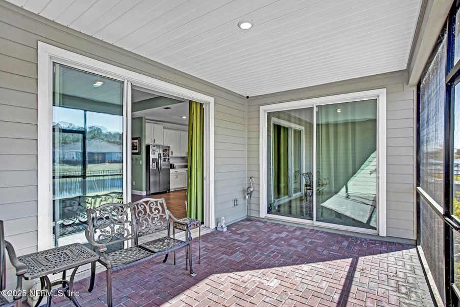 Exterior details and patio area of a home in Tributary: Lakeview at Tributary 60's, Yulee (Image 3).