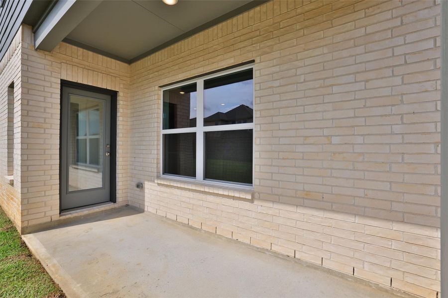 Exterior details and patio area of a home in Sunterra, Katy (Image 21).