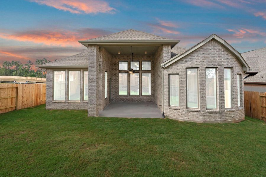 Exterior details and patio area of a home in Wildtree, Magnolia (Image 19).