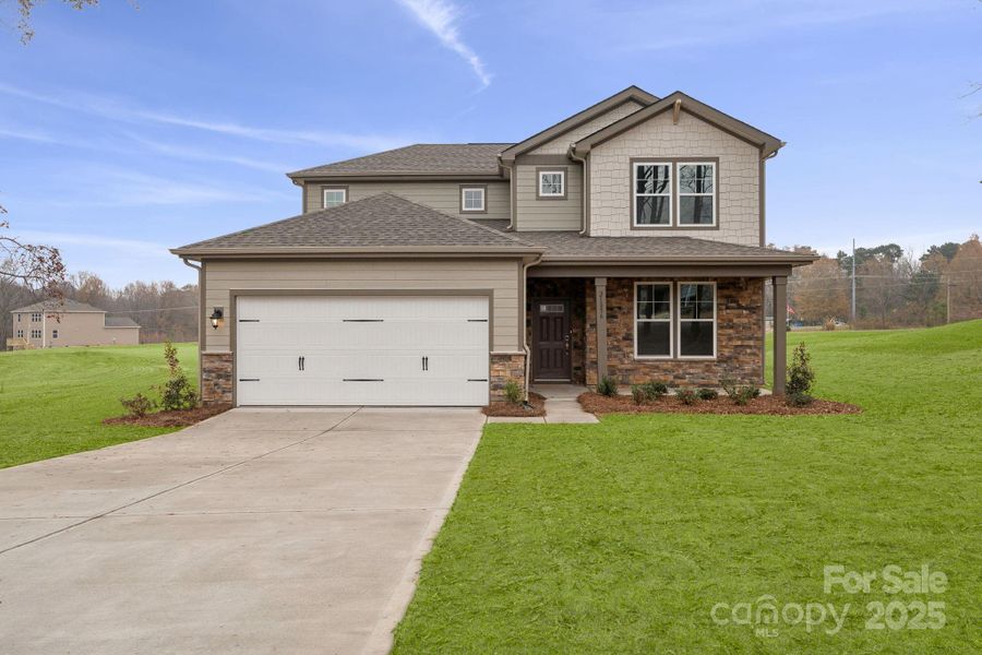 Front exterior of a new home in Running Creek, Locust, NC, highlighting curb appeal (Image 6). Front exterior of a new home in Running Creek, Locust, NC, highlighting curb appeal (Image 6).