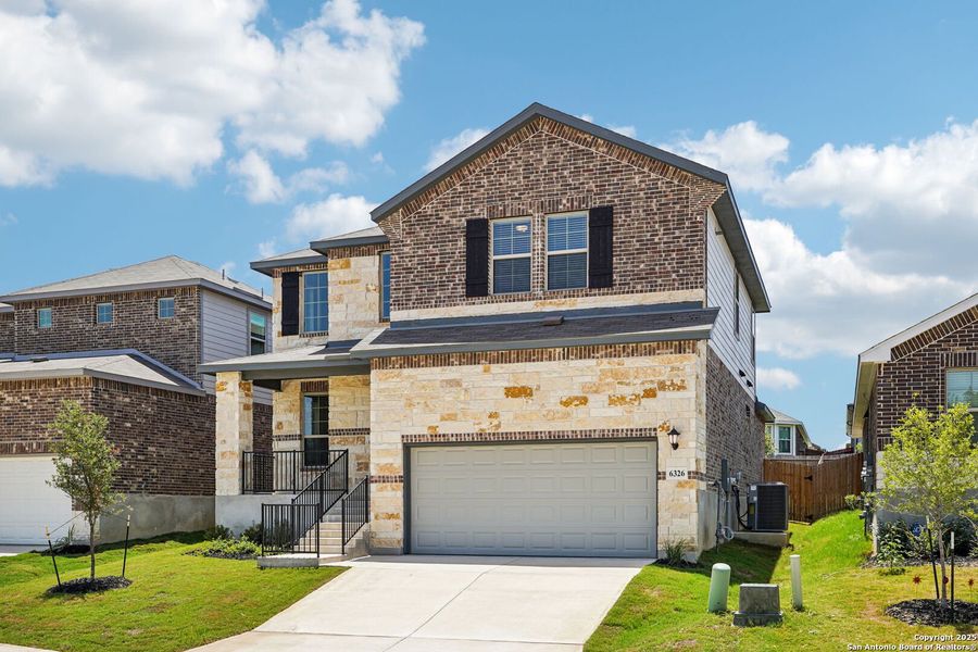 Front exterior of a new home in Comanche Ridge, San Antonio, TX, highlighting curb appeal (Image 27). Front exterior of a new home in Comanche Ridge, San Antonio, TX, highlighting curb appeal (Image 27).