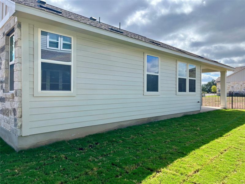 Front exterior of a new home in Anthem Cottages, Kyle, TX, highlighting curb appeal (Image 1). Front exterior of a new home in Anthem Cottages, Kyle, TX, highlighting curb appeal (Image 1).