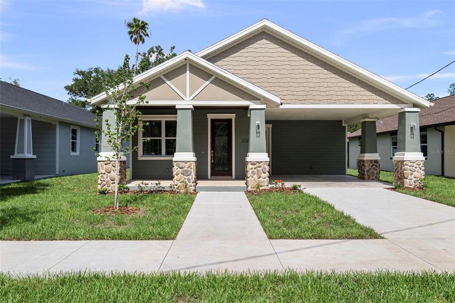 Front exterior of a new home in , Tampa, FL, highlighting curb appeal (Image 18). Front exterior of a new home in , Tampa, FL, highlighting curb appeal (Image 18).