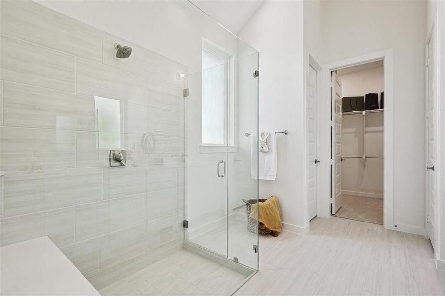 Bathroom featuring a shower with shower door