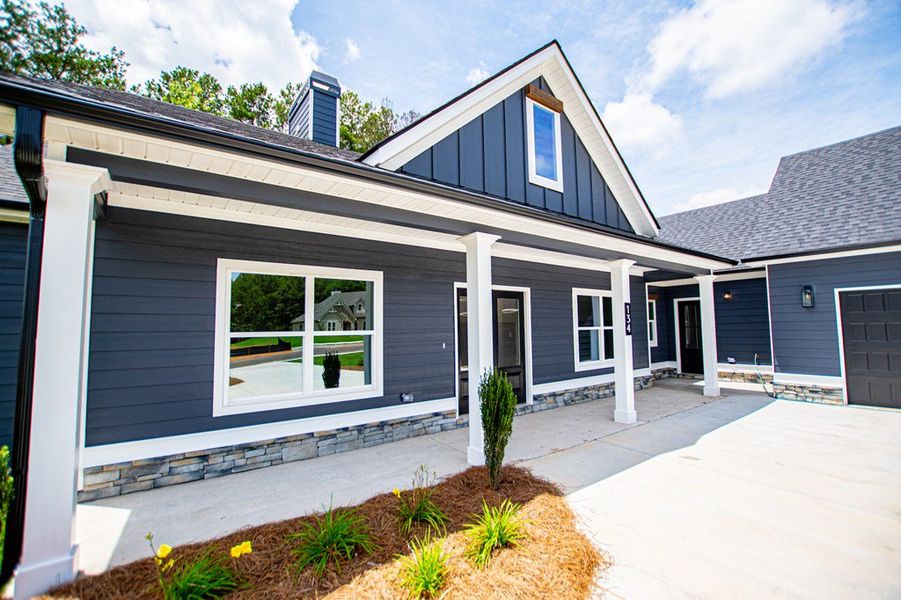 Exterior details and patio area of a home in WOODMONT RESERVE, Roopville (Image 3).