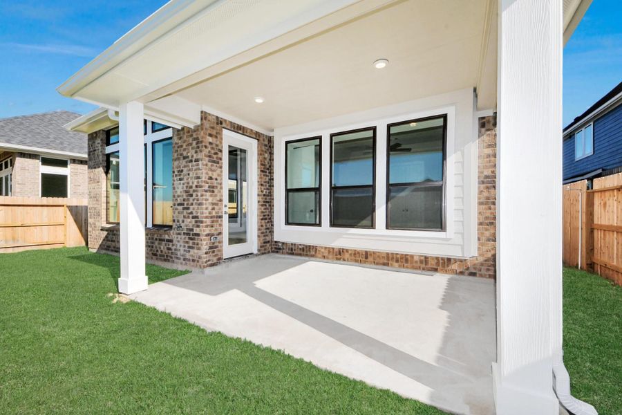 Exterior details and patio area of a home in Sunterra: Premier Collection, Katy (Image 6).