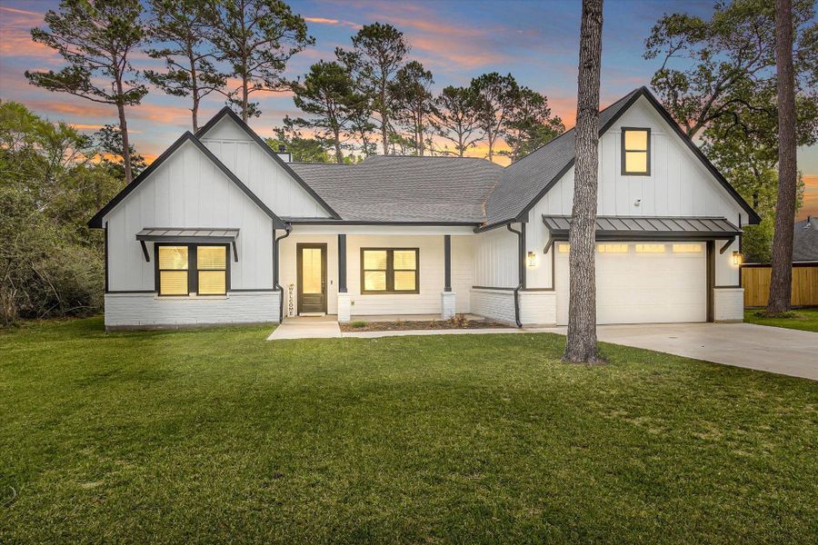 Front exterior of a new home in , Magnolia, TX, highlighting curb appeal (Image 22).