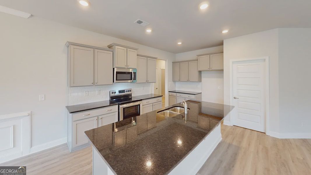 Furnished interior view inside a new home in Holliday Pass, Griffin (Image 4).