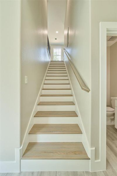 Wood stair treads grace your walk up to the 3 guest bedrms, full bath & extra landing space