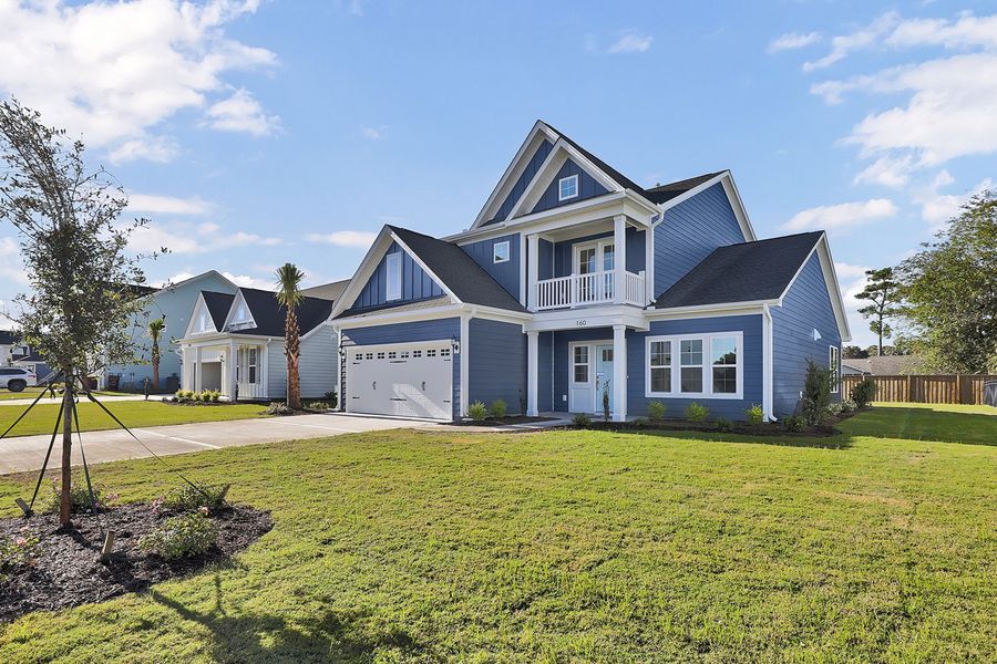 Front exterior of a new home in East Wynd, Hampstead, NC, highlighting curb appeal (Image 2). Front exterior of a new home in East Wynd, Hampstead, NC, highlighting curb appeal (Image 2).