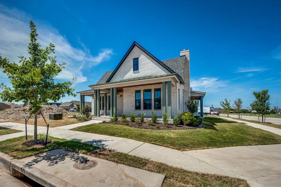 Front exterior of a new home in , Midlothian, TX, highlighting curb appeal (Image 15).