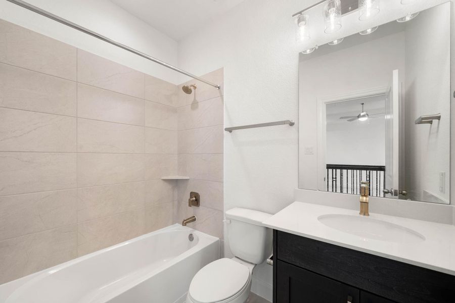 This full sized bathroom is located in the hallway of the upstairs and easily accessible to the bedroom.