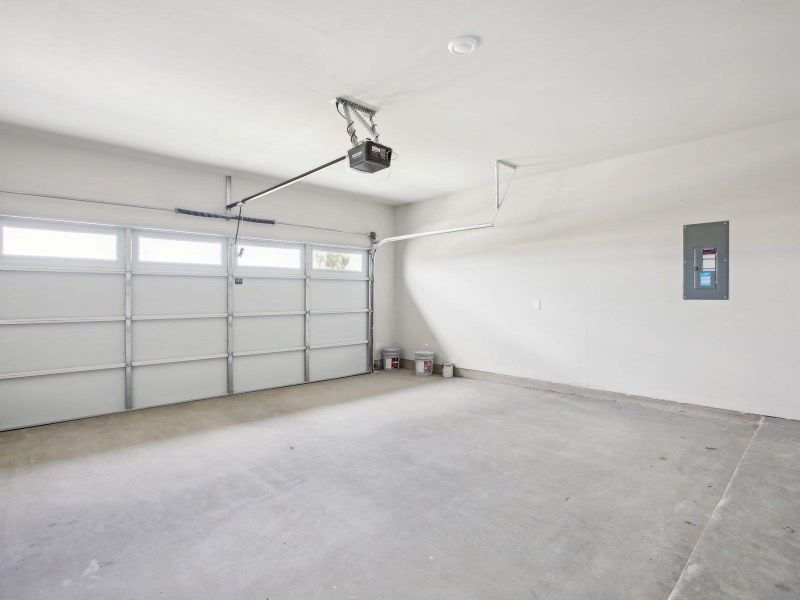 Garage with electric panel and a garage door opener Garage with electric panel and a garage door opener
