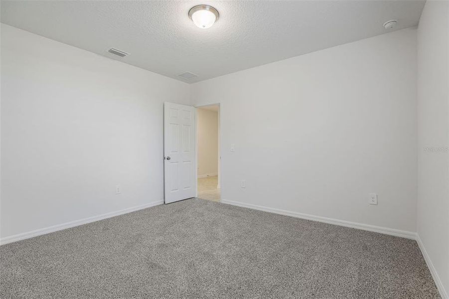 Spacious, unfurnished interior of a new home in Bradbury Creek - Signature Series, Haines City (Image 37).