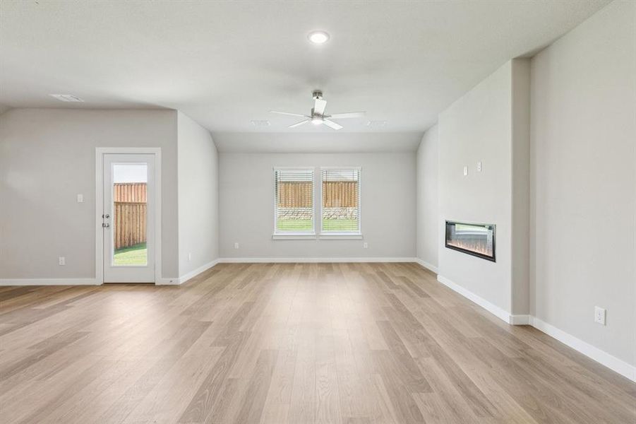 Living room in the Heisman home plan by Trophy Signature Homes – REPRESENTATIVE PHOTO