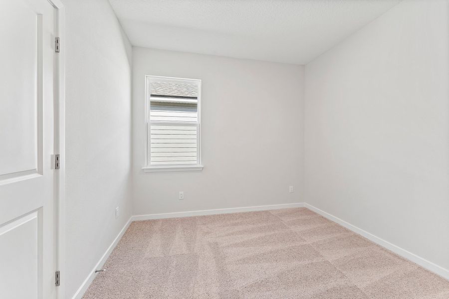 Lot 19 Cedar II Guest Room with Window and Closet at Camden Woods in Kingsland, GA