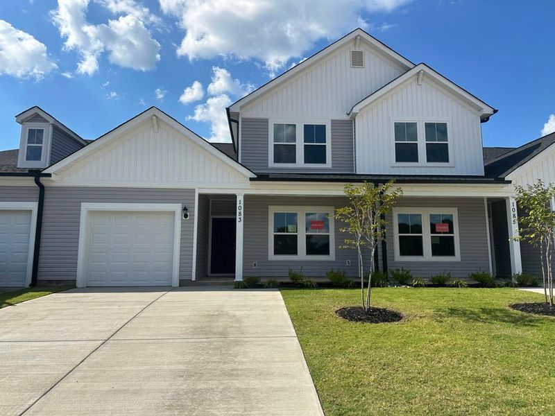 Front exterior of a new home in Windsor Townhomes, North Augusta, SC, highlighting curb appeal (Image 1).