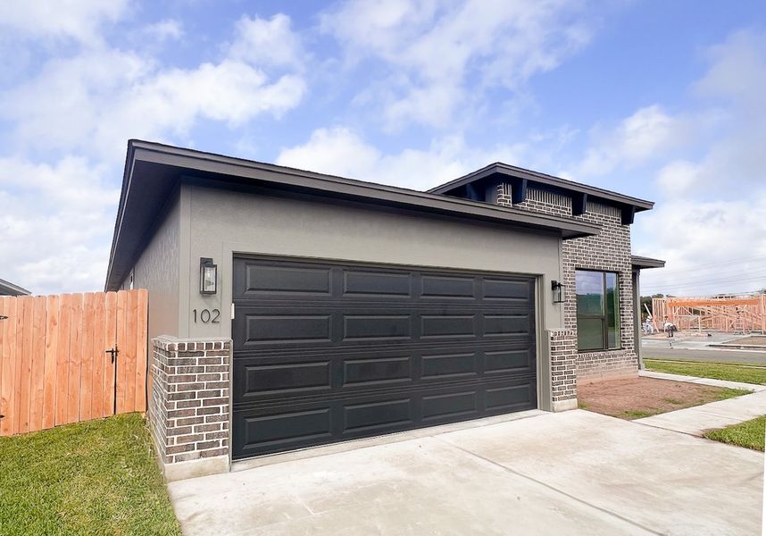 Front exterior of a new home in TerraVista, Victoria, TX, highlighting curb appeal (Image 20).