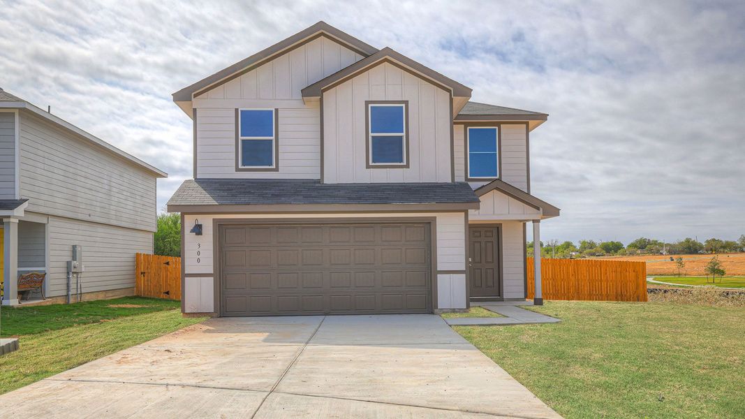 Front exterior of a new home in Ladera, Luling, TX, highlighting curb appeal (Image 2). Front exterior of a new home in Ladera, Luling, TX, highlighting curb appeal (Image 2).