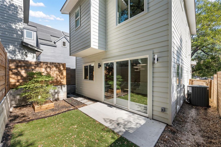Back of house featuring a fenced backyard and a patio area