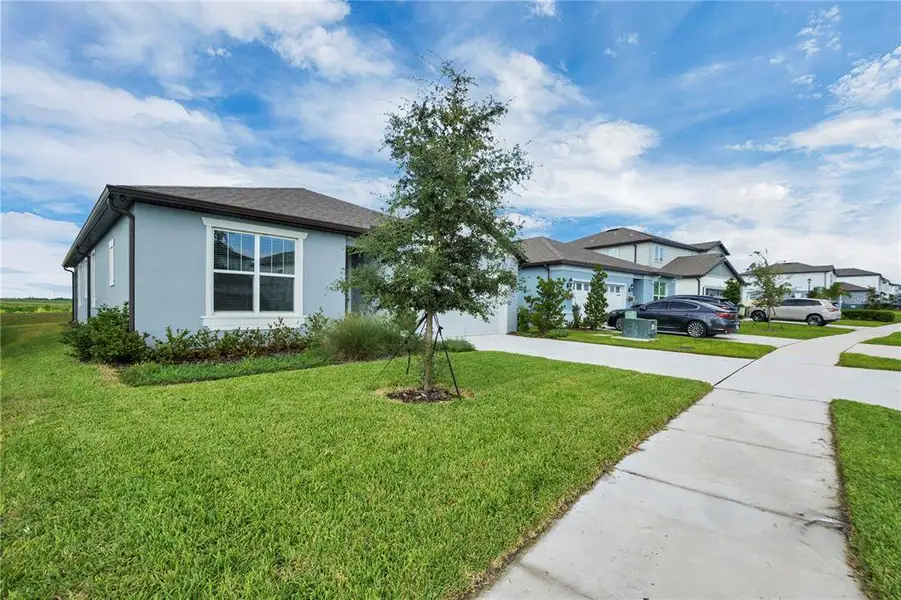 Front exterior of a new home in , Lake Alfred, FL, highlighting curb appeal (Image 23). Front exterior of a new home in , Lake Alfred, FL, highlighting curb appeal (Image 23).