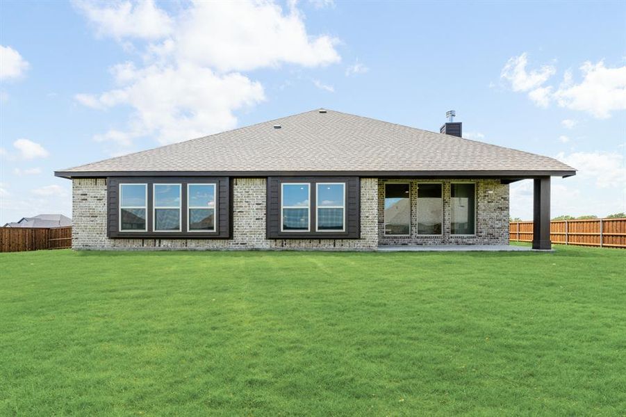 Front exterior of a new home in Wildcat Ridge Phase 2 and 4, Godley, TX, highlighting curb appeal (Image 24). Front exterior of a new home in Wildcat Ridge Phase 2 and 4, Godley, TX, highlighting curb appeal (Image 24).