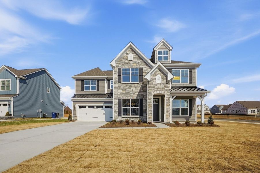 Front exterior of a new home in Harmony, Harrisburg, NC, highlighting curb appeal (Image 28). Front exterior of a new home in Harmony, Harrisburg, NC, highlighting curb appeal (Image 28).