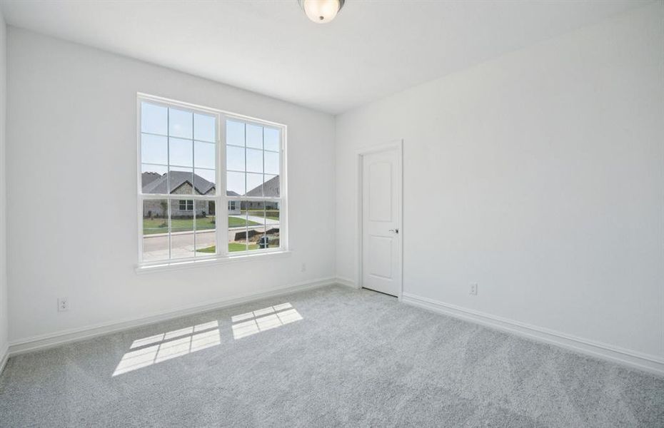 Spacious secondary bedroom with large windows Spacious secondary bedroom with large windows