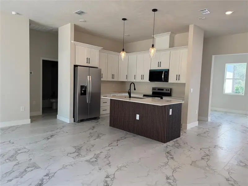 Furnished interior view inside a new home in , Dunnellon (Image 4).