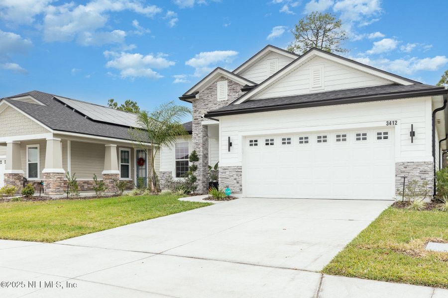 Front exterior of a new home in Hyland Trail, Green Cove Springs, FL, highlighting curb appeal (Image 21). Front exterior of a new home in Hyland Trail, Green Cove Springs, FL, highlighting curb appeal (Image 21).