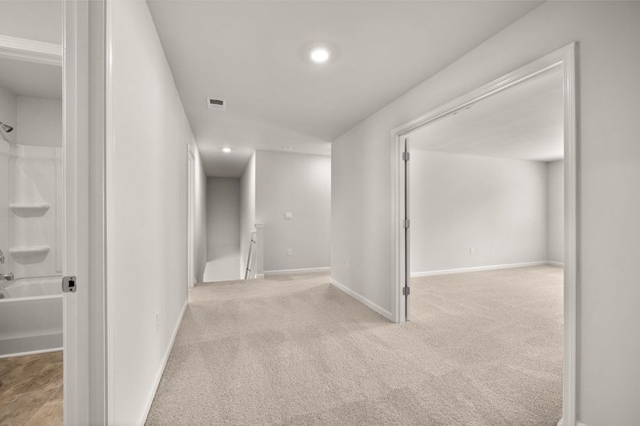 Representative unfurnished interior of a home built from the Mansfield by D.R. Horton in Southwind Village, Evans (Image 31).