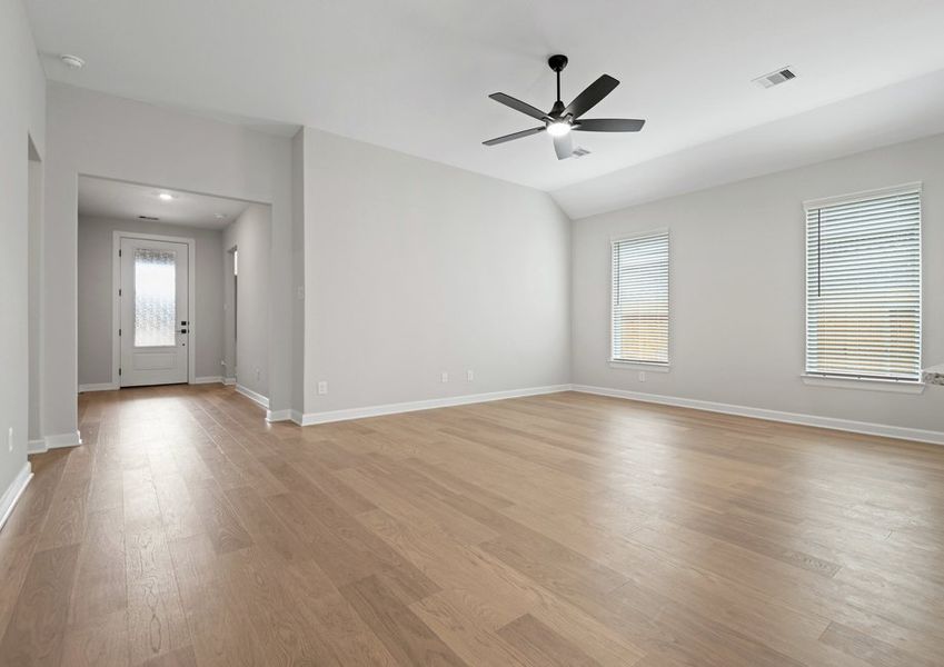 Foyer that leads in to a family room with vinyl flooring Foyer that leads in to a family room with vinyl flooring