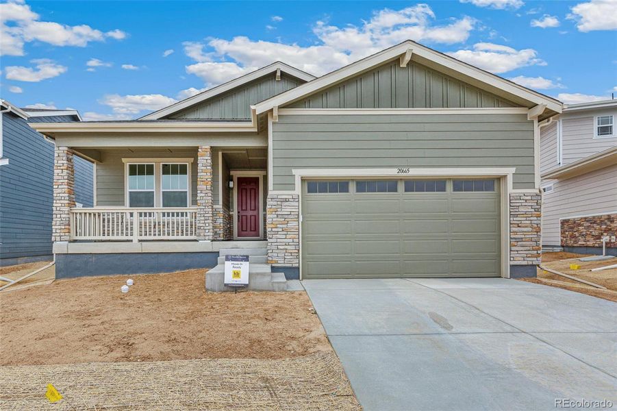 Front exterior of a new home in Painted Prairie, Aurora, CO, highlighting curb appeal (Image 2).