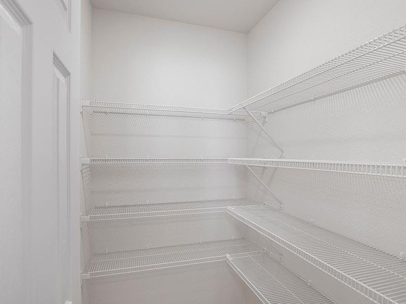 Enjoy the storage convenience of a walk-in pantry. Enjoy the storage convenience of a walk-in pantry.