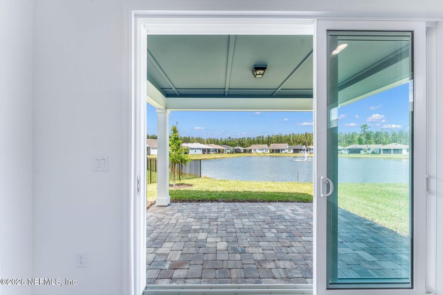 Exterior details and patio area of a home in Del Webb Wildlight, Wildlight (Image 28).