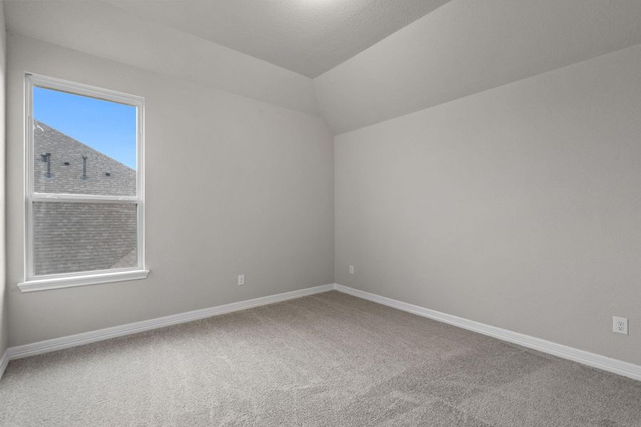 Your secondary bedroom features plush carpet, fresh paint, closet, and a large window that lets in plenty of natural lighting.