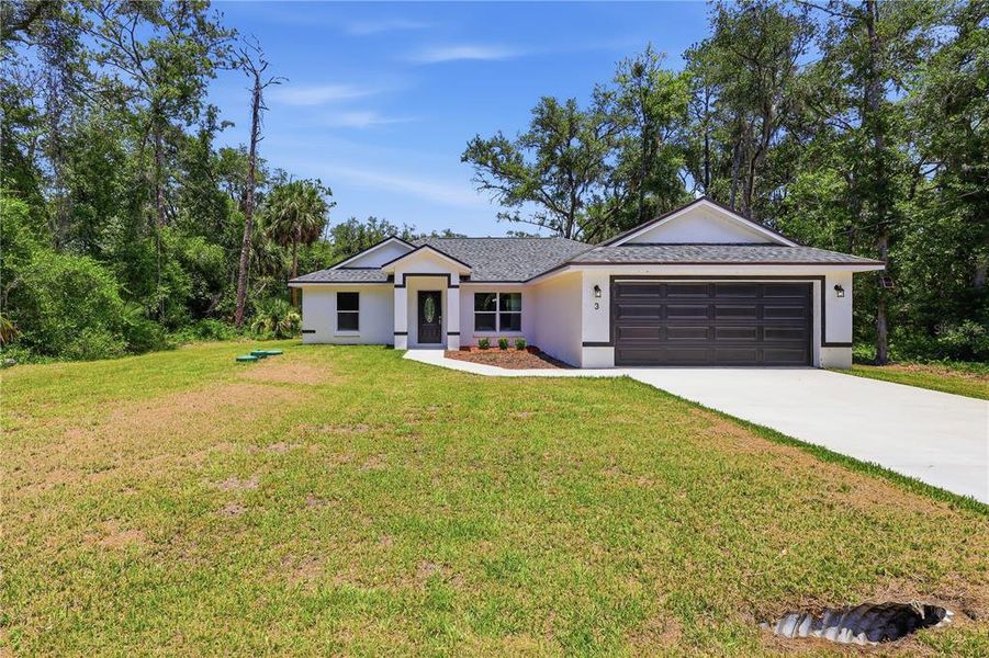 Front exterior of a new home in , Ocklawaha, FL, highlighting curb appeal (Image 2). Front exterior of a new home in , Ocklawaha, FL, highlighting curb appeal (Image 2).