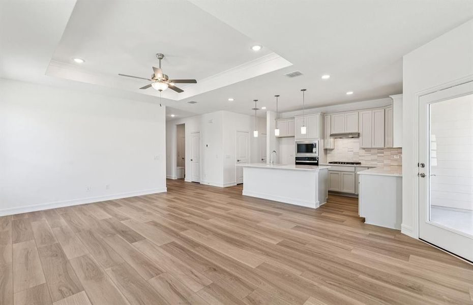 Spacious gathering room with access to backyard Spacious gathering room with access to backyard