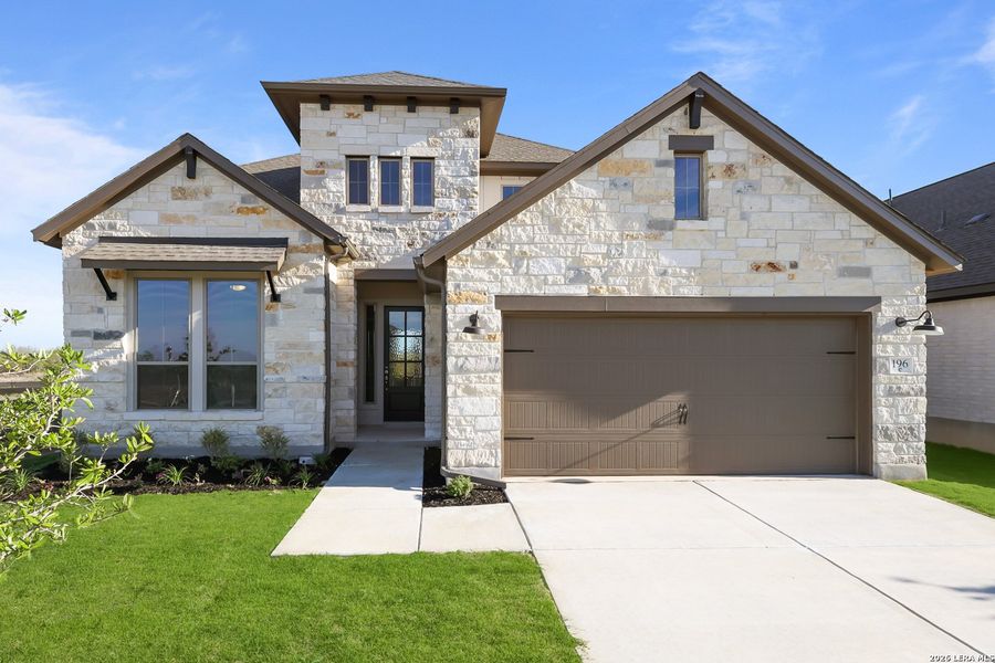 Front exterior of a new home in Nopal Valley, San Antonio, TX, highlighting curb appeal (Image 2). Front exterior of a new home in Nopal Valley, San Antonio, TX, highlighting curb appeal (Image 2).